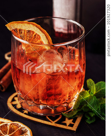 Dark orange drink in glass close up 101927320