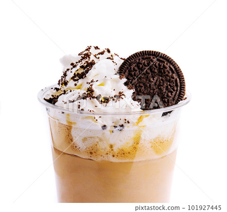 Chocolate milkshake covered with whipped cream in plastic glass isolated 101927445