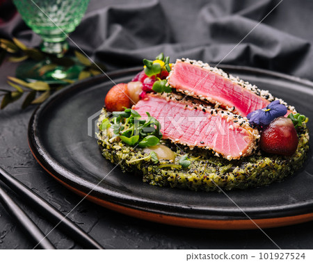 Rare ahi tuna steak slices with fresh herbs Rare ahi tuna steak slices with fresh herbs 101927524