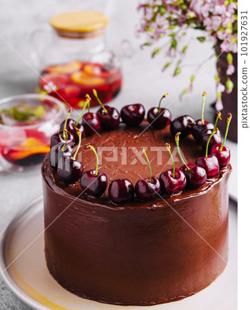 Chocolate cake decorated with sweet cherries 101927631