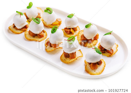 Italian style appetizer on white plate Italian style appetizer on white plate 101927724