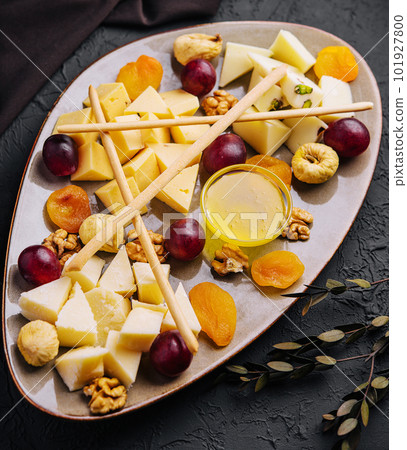 Cheese platter with organic cheeses, fruits, nuts and wine Cheese platter with organic cheeses, fruits, nuts and wine 101927800