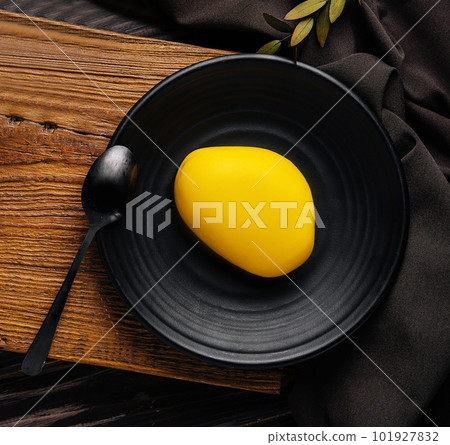 Contemporary mango mini mousse cakes top view 101927832