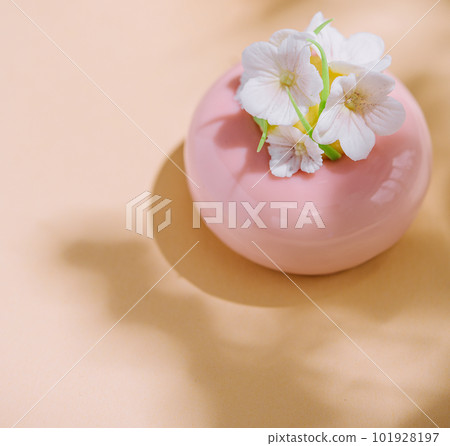 Pink mousse cakes decorated with white flowers Pink mousse cakes decorated with white flowers 101928197