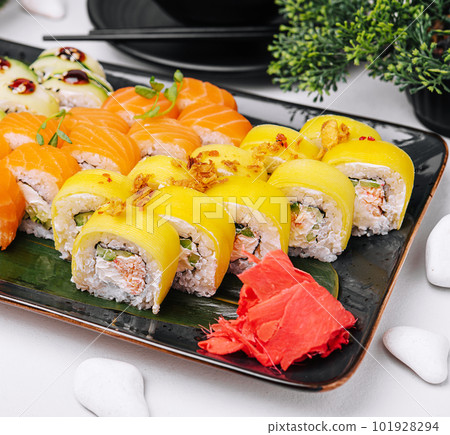 Traditional fresh japanese sushi rolls on stone plate Traditional fresh japanese sushi rolls on stone plate 101928294