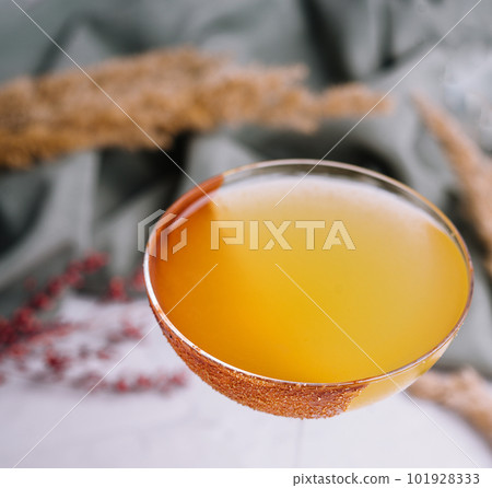 Glass of sidecar orange cocktail closeup 101928333
