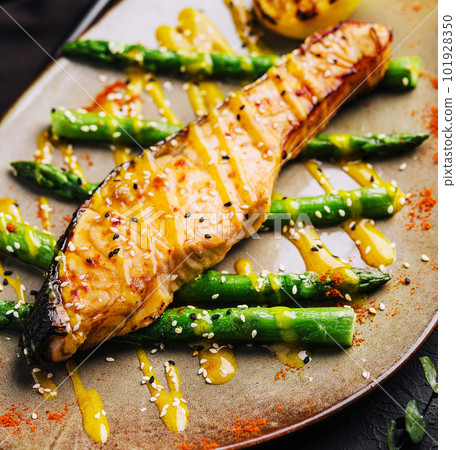 Cooked asparagus with salmon and lemon Cooked asparagus with salmon and lemon 101928350