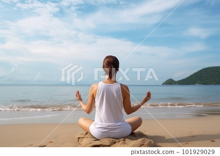 Meditating woman on the beach. Created with generative Ai technology. 101929029