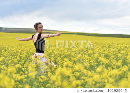 Young woman enjoying freedom in the outdoors 101929645