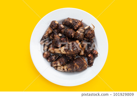 Organic taro fruit in white plate Organic taro fruit in white plate 101929809