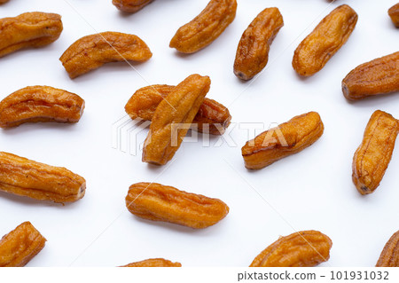 Sun-dried bananas on white background. Sun-dried bananas on white background. 101931032
