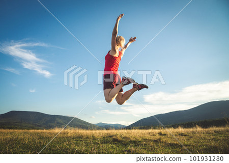 Young woman on the top of mountain 101931280