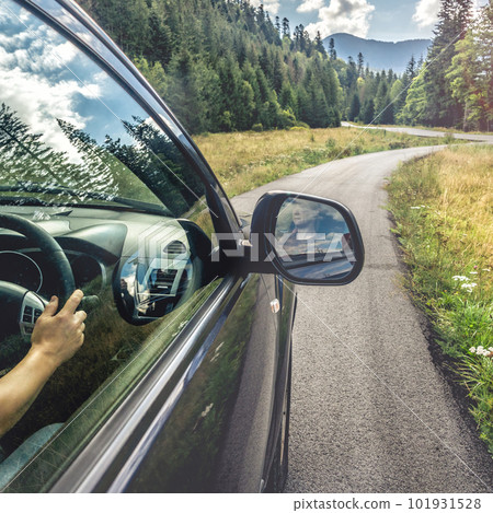 car for traveling with a mountain road 101931528