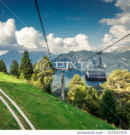 gondola ski lift in mountain ski resort, green forest gondola ski lift in mountain ski resort, green forest 101931634