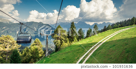gondola ski lift in mountain ski resort, green forest gondola ski lift in mountain ski resort, green forest 101931636