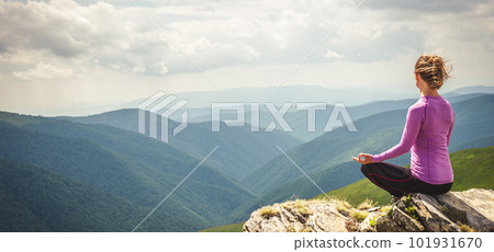 Young woman on the top of mountain 101931670