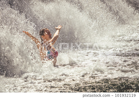 Beautiful lady staying by the waterfall 101932119