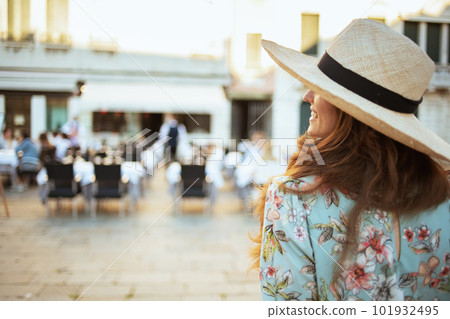 stylish traveller woman in floral dress enjoying promenade stylish traveller woman in floral dress enjoying promenade 101932495