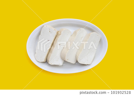 White tofu in yellow plate on yellow background White tofu in yellow plate on yellow background 101932528