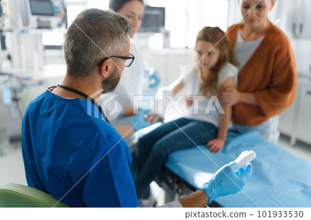 Little girl with her mother in surgery examination. Little girl with her mother in surgery examination. 101933530