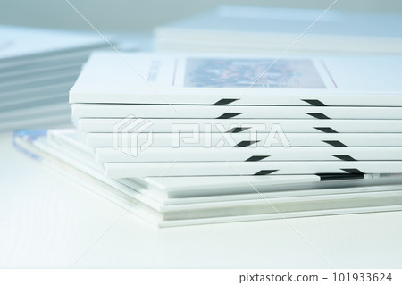 stack of photo books close-up, partial blur 101933624