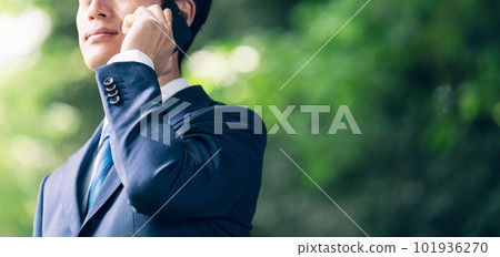 Businessman talking in nature Businessman talking in nature 101936270