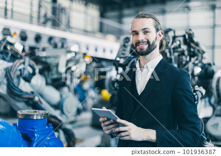 Portrait jewish businessman standing happy in machine factory warehouse for success CEO business industry owner Portrait jewish businessman standing happy in machine factory warehouse for success CEO business industry owner 101936387