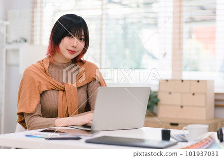 Website designer, Creative planning phone app development template layout framework wireframe design, User experience concept, Young asian woman UX designer working on smartphone application at office Website designer, Creative planning phone app development template layout framework wireframe design, User experience concept, Young asian woman UX designer working on smartphone application at office 101937031