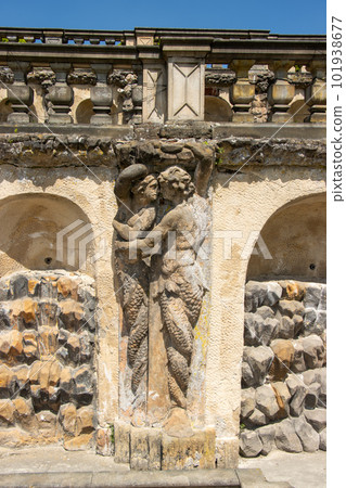 Two stone figures are kissing. Embracing male and female half figures Two stone figures are kissing. Embracing male and female half figures 101938677