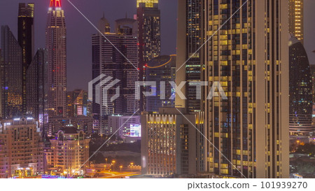 Row of the tall buildings around Sheikh Zayed Road and DIFC district aerial day to night timelapse in Dubai 101939270