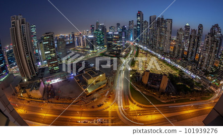 Panoramic skyline of Bay Avenue with modern towers residential development in Business Bay aerial day to night timelapse, Dubai 101939276