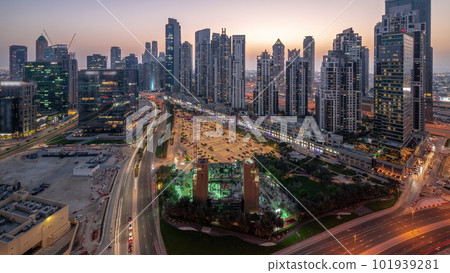 Bay Avenue with modern towers residential development in Business Bay aerial panoramic day to night timelapse, Dubai Bay Avenue with modern towers residential development in Business Bay aerial panoramic day to night timelapse, Dubai 101939281