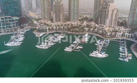 Luxury boats and yachts docked in Dubai Marina aerial all day timelapse. Luxury boats and yachts docked in Dubai Marina aerial all day timelapse. 101939353