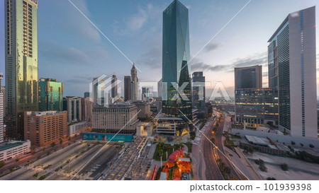 Dubai International Financial district aerial night to day timelapse. Panoramic view of business office towers. Dubai International Financial district aerial night to day timelapse. Panoramic view of business office towers. 101939398