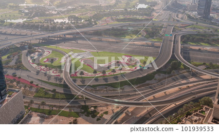 Huge highway crossroad junction between JLT district and Dubai Marina intersected by Sheikh Zayed Road aerial timelapse. 101939533