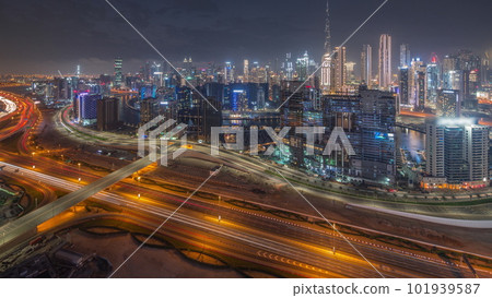 Skyline with modern architecture of Dubai business bay towers day to night timelapse. Aerial view 101939587