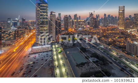 Dubai's business bay towers aerial day to night timelapse. Rooftop view of some skyscrapers 101939621