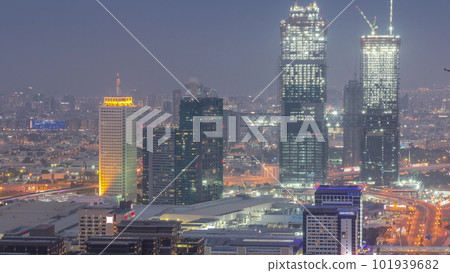 Aerial view of skyscrapers with World Trade center in Dubai day to night timelapse. 101939682