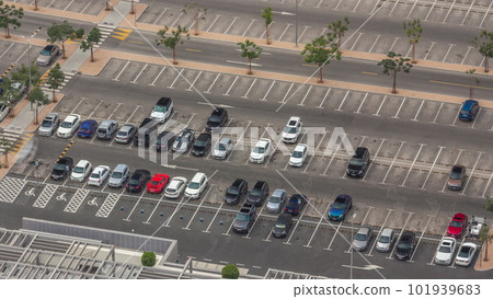 Big parking lot near mall crowded by many cars timelapse aerial view 101939683