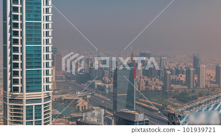 Dubai Aerial view showing haze over al barsha heights and greens district area timelapse 101939721