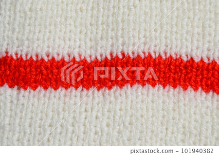 Handmade knitted fabric red and white wool background texture Handmade knitted fabric red and white wool background texture 101940382