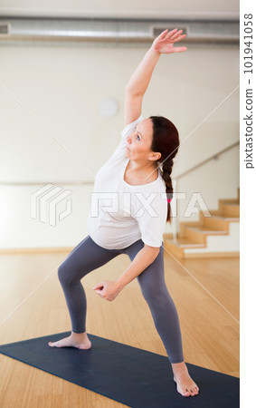 Woman does yoga in the gym.pregnant woman does yoga in the gym 101941058