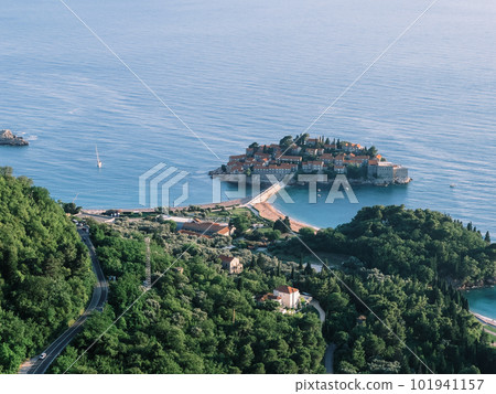 View from the mountain to the resort village of Sveti Stefan next to the island. Montenegro View from the mountain to the resort village of Sveti Stefan next to the island. Montenegro 101941157