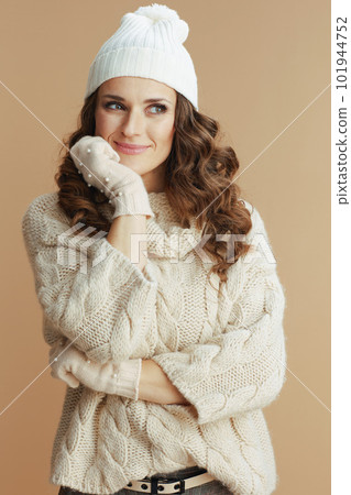 pensive elegant woman isolated on beige background 101944752