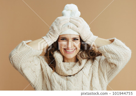 smiling elegant woman isolated on beige background smiling elegant woman isolated on beige background 101944755
