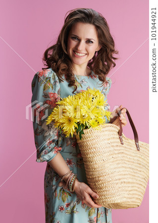 happy elegant woman in floral dress on pink 101944921