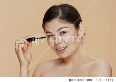 Portrait of modern asian woman with mascara 101945134