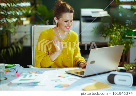 business owner woman in green office having virtual meeting business owner woman in green office having virtual meeting 101945374