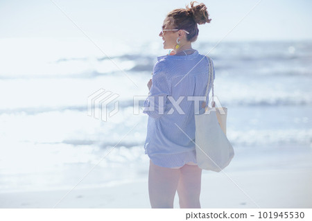 happy modern 40 years old woman at beach happy modern 40 years old woman at beach 101945530