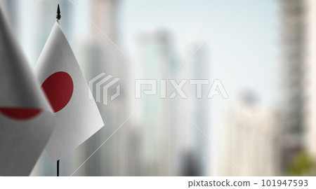 Small flags of the Japan on an abstract blurry background Small flags of the Japan on an abstract blurry background 101947593